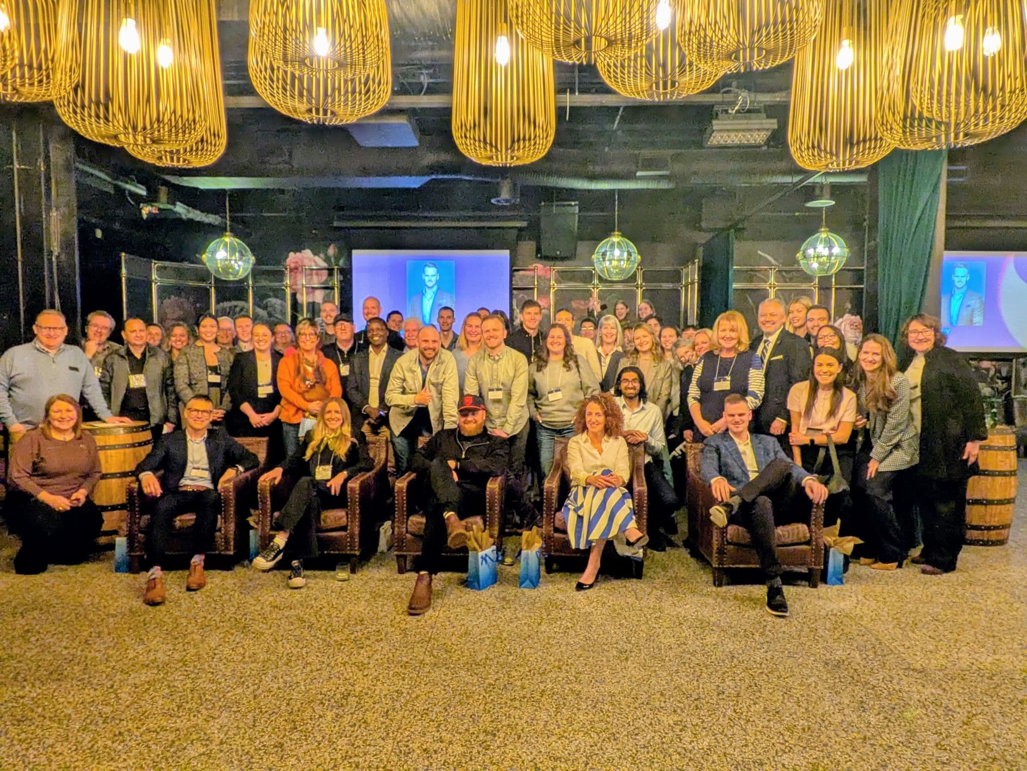Large professional cohort gathered after a training event