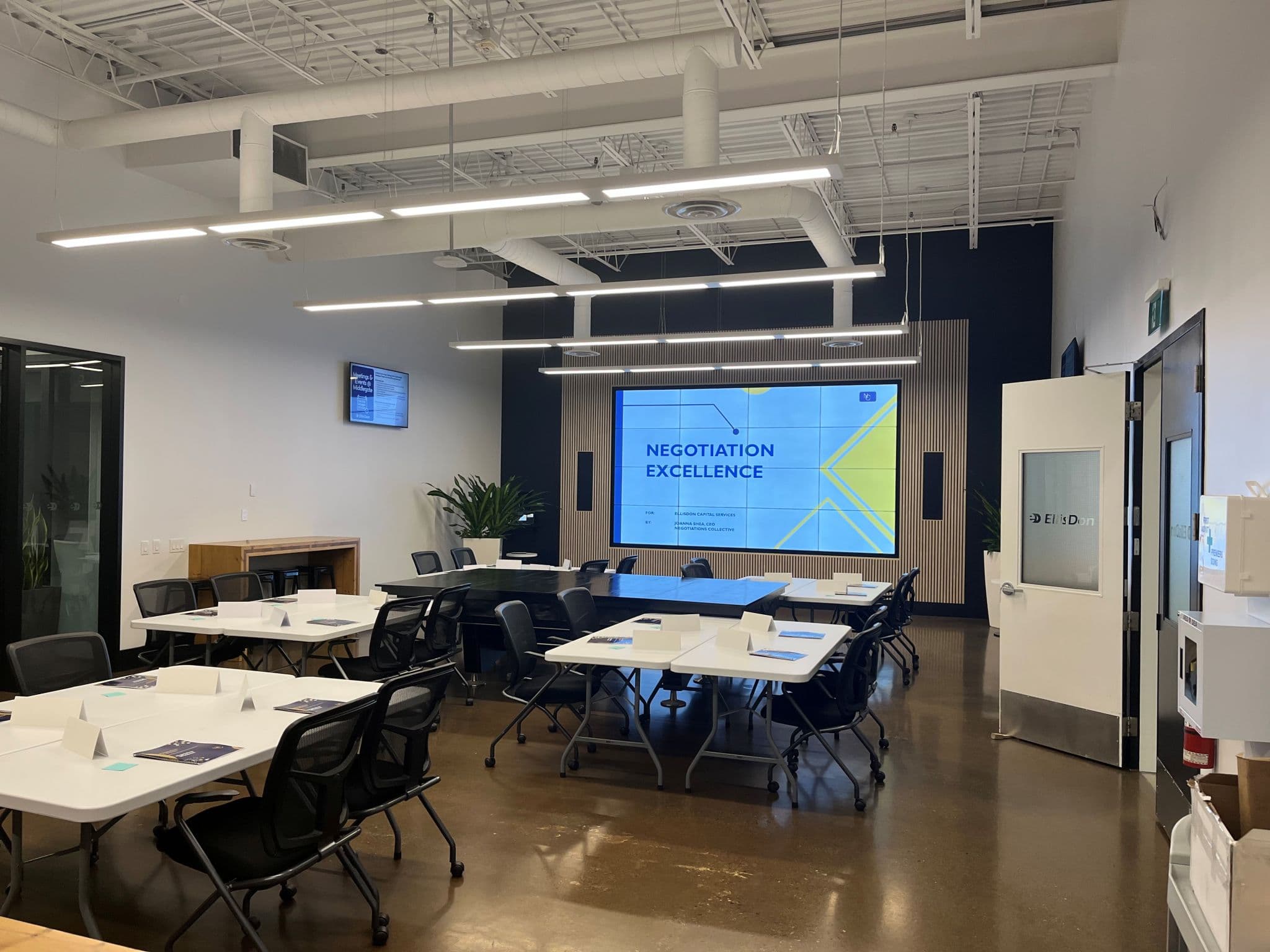 Training room prepared with Negotiations Collective materials before a session