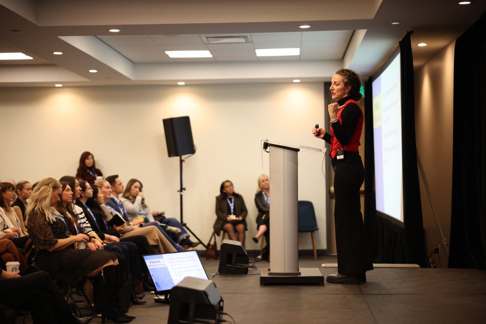 Negotiations Collective facilitator teaching negotiation concepts to a live audience