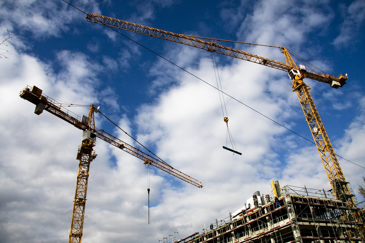Tower cranes above a building under construction