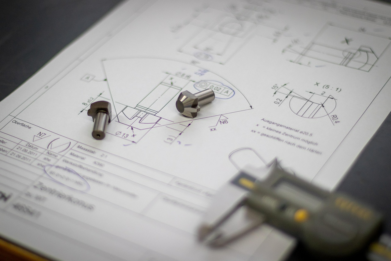 Engineering drawings with machined components and a digital caliper